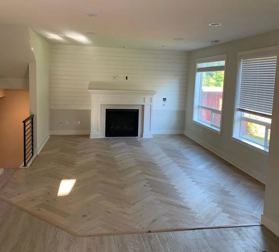 Herringbone hardwood floor installed in a Seattle-area living room